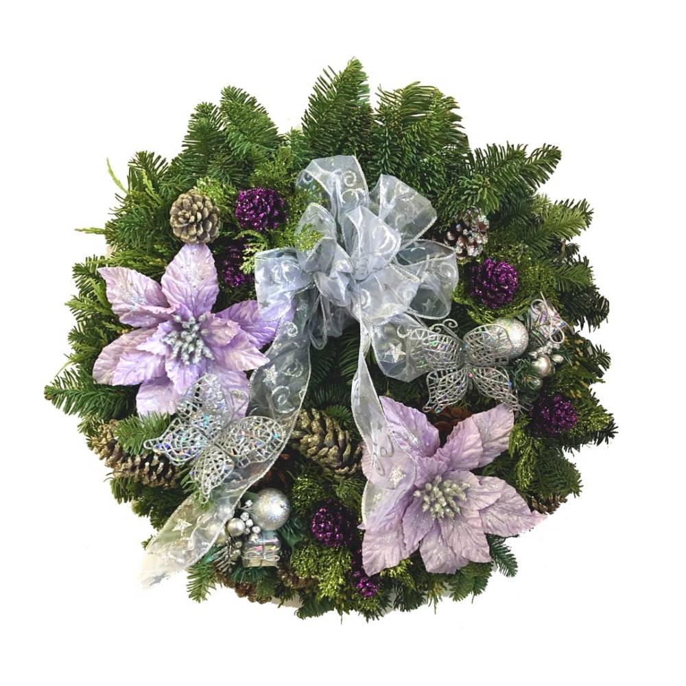 Noble Fir Mixed Wreath decorated with purple, lavender and silver flowers, pine cones, and bows