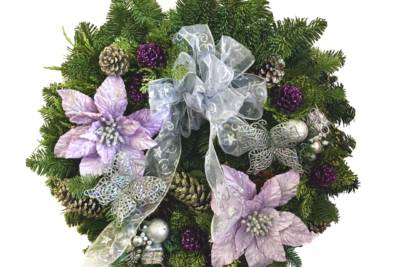 Noble Fir Mixed Wreath decorated with purple, lavender and silver flowers, pine cones, and bows