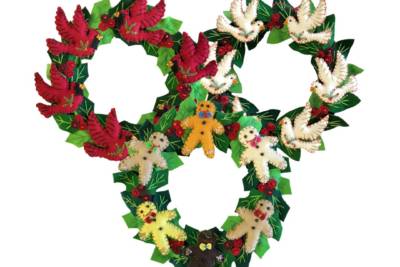 Handsewn Christmas wreath decorated with stuffed birds and bears